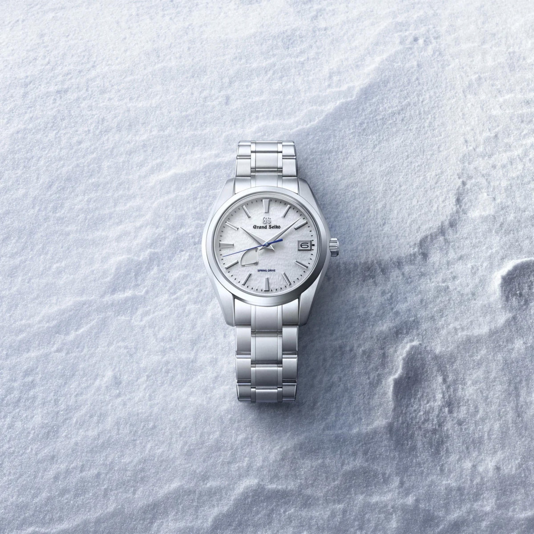 Grand Seiko SBGA211 resting in fresh snow