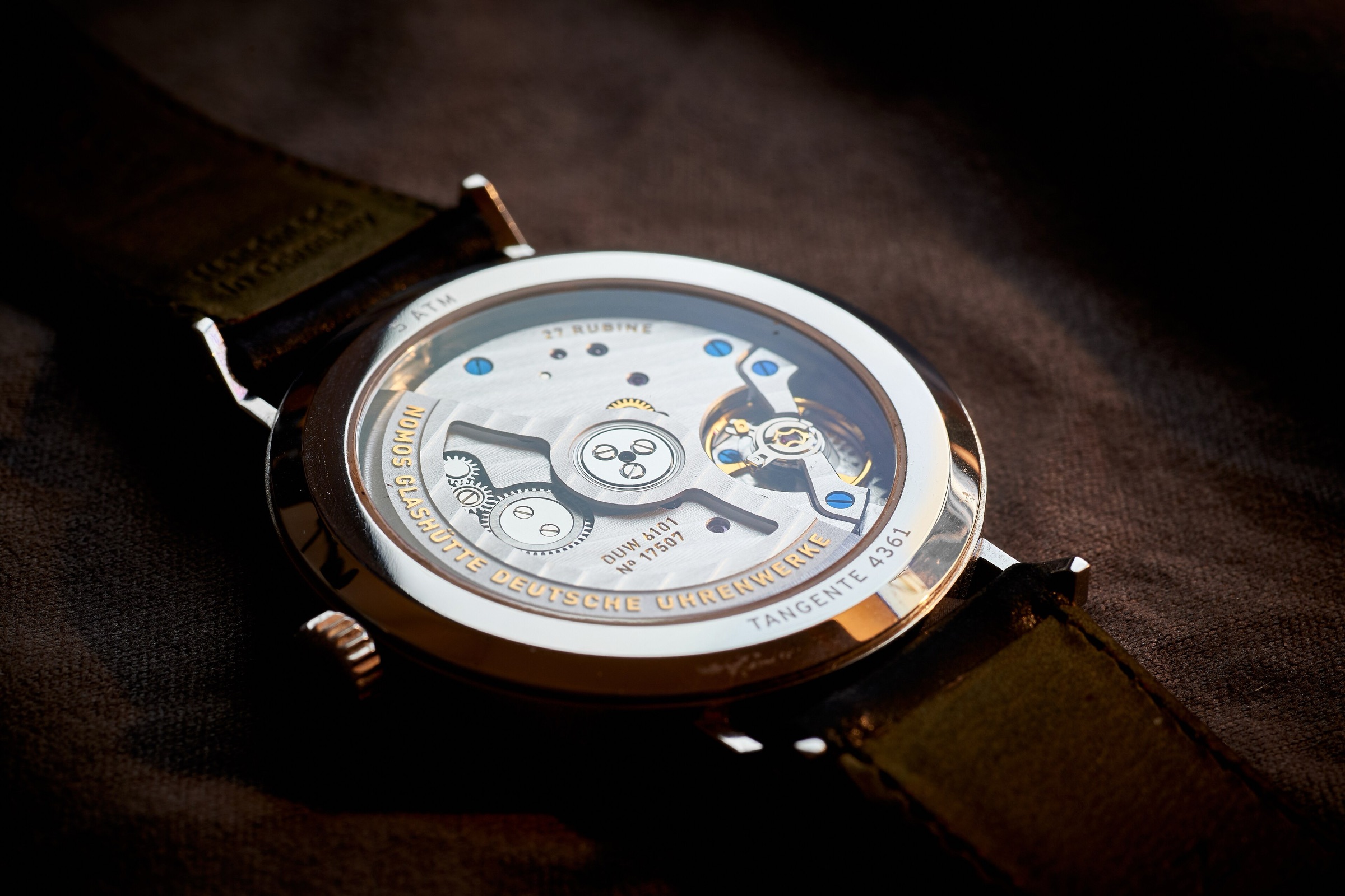 An automatic movement seen through a sapphire caseback